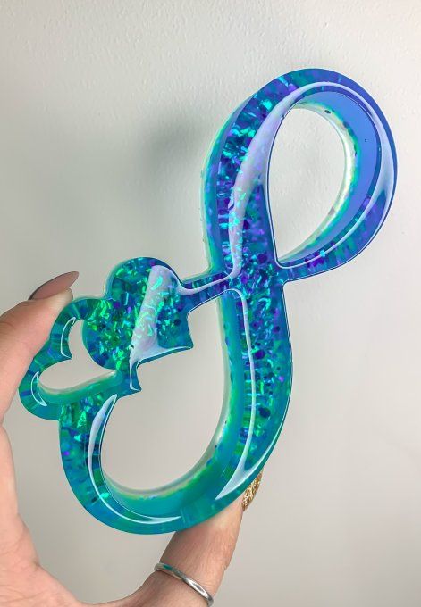 Symbole infini double bleu et paillettes holographiques 
