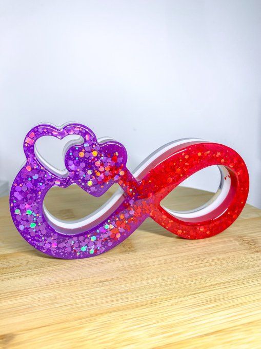 Symbole infini violet/rouge/blanc et paillettes