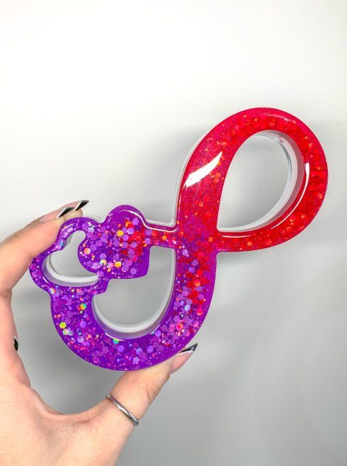 Symbole infini violet/rouge/blanc et paillettes